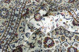 Surface texture of 2000s Kashan rug with natural Wool and intricate pattern