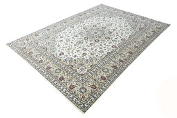 Corner detail of 2000s Kashan rug showing border pattern and Wool pile