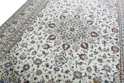 Backside of handmade 2000s Kashan rug showing knot structure and weave density