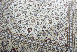 Close-up detail of 2000s Kashan rug from Iran / Persia showing Wool weave