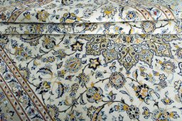 Close-up detail of 2000s Kashan rug from Iran / Persia showing Wool weave