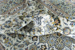 Surface texture of 2000s Kashan rug with natural Wool and intricate pattern