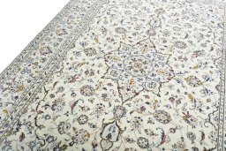 Backside of handmade 2000s Kashan rug showing knot structure and weave density