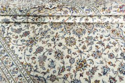 Close-up detail of 2000s Kashan rug from Iran / Persia showing Wool weave