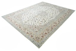 Corner detail of 2000s Kashan rug showing border pattern and Wool pile