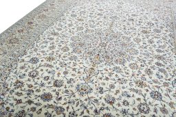 Backside of handmade 2000s Kashan rug showing knot structure and weave density