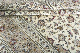 Close-up detail of 2000s Kashan rug from Iran / Persia showing Wool weave