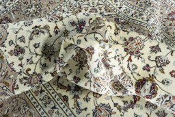 Surface texture of 2000s Kashan rug with natural Wool and intricate pattern