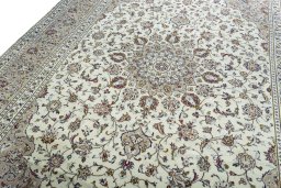 Backside of handmade 2000s Kashan rug showing knot structure and weave density