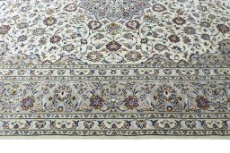 Corner detail of 2000s Kashan rug showing border pattern and Wool pile
