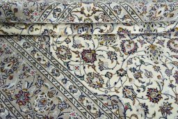 Close-up detail of 2000s Kashan rug from Iran / Persia showing Wool weave