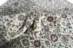 Surface texture of 2000s Kashan rug with natural Wool and intricate pattern