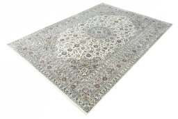 Corner detail of 2000s Kashan rug showing border pattern and Wool pile