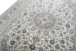 Backside of handmade 2000s Kashan rug showing knot structure and weave density
