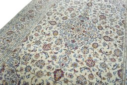Backside of handmade 2000s Kashan rug showing knot structure and weave density