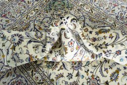 Surface texture of 2000s Kashan rug with natural Wool and intricate pattern