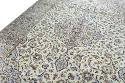 Backside of handmade 2000s Kashan rug showing knot structure and weave density