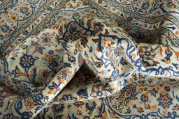 Surface texture of 2000s Kashan rug with natural Wool and intricate pattern