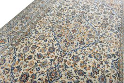 Backside of handmade 2000s Kashan rug showing knot structure and weave density