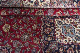 Close-up detail of 2000s Kashan rug from Iran / Persia showing Wool weave