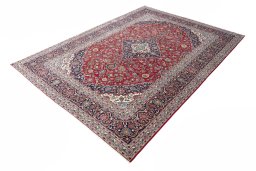 Corner detail of 2000s Kashan rug showing border pattern and Wool pile