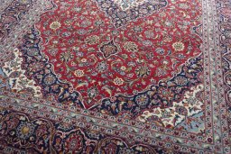Close-up detail of 2000s Kashan rug from Iran / Persia showing Wool weave