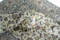 Surface texture of 2000s Kashan rug with natural Wool and intricate pattern