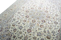 Backside of handmade 2000s Kashan rug showing knot structure and weave density