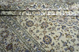 Close-up detail of 2000s Kashan rug from Iran / Persia showing Wool weave