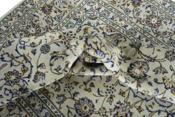Surface texture of 2000s Kashan rug with natural Wool and intricate pattern