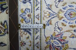 Backside of handmade 2000s Kashan rug showing knot structure and weave density