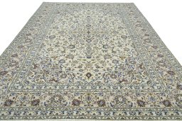 Surface texture of 2000s Kashan rug with natural Wool and intricate pattern