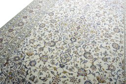 Backside of handmade 2000s Kashan rug showing knot structure and weave density