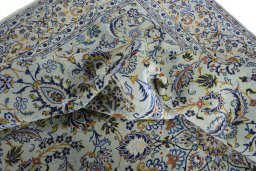 Surface texture of 2000s Kashan rug with natural Wool and intricate pattern