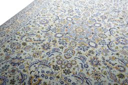 Backside of handmade 2000s Kashan rug showing knot structure and weave density