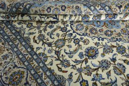 Close-up detail of 2000s Kashan rug from Iran / Persia showing Wool weave