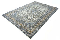 Corner detail of 2000s Kashan rug showing border pattern and Wool pile