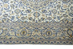 Corner detail of 2000s Kashan rug showing border pattern and Wool pile