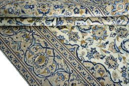 Close-up detail of 2000s Kashan rug from Iran / Persia showing Wool weave