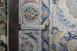 Backside of handmade 1950s Kashan rug showing knot structure and weave density