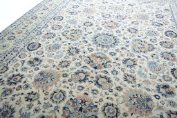 Backside of handmade 1950s Kashan rug showing knot structure and weave density