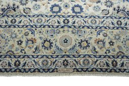 Full view of 1950s Kashan rug from Iran / Persia, 455 × 340 cm in Beige tones