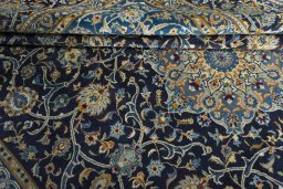 Close-up detail of 2000s Kashan rug from Iran / Persia showing Wool weave