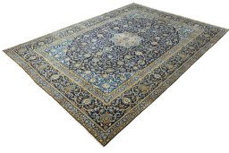 Corner detail of 2000s Kashan rug showing border pattern and Wool pile