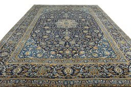 Surface texture of 2000s Kashan rug with natural Wool and intricate pattern