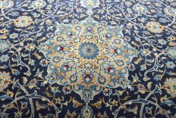 Central medallion detail of 2000s Kashan rug from Iran / Persia