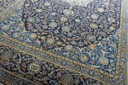 Close-up detail of 2000s Kashan rug from Iran / Persia showing Wool weave