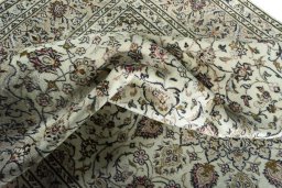 Surface texture of 2000s Kashan rug with natural Wool and intricate pattern