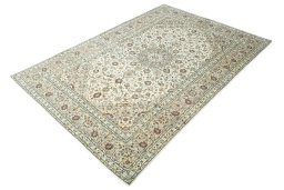 Corner detail of 2000s Kashan rug showing border pattern and Wool pile