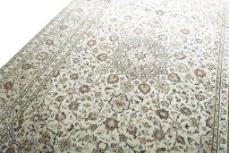Backside of handmade 2000s Kashan rug showing knot structure and weave density